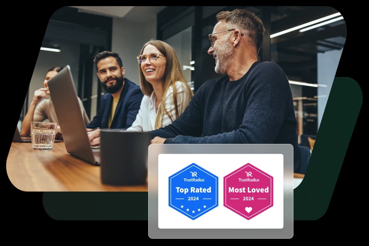 This image shows a group of people collaborating overlaid with two TrustRadius badges that Dashlane was awarded, representing why Dashlane is a top choice password manager for businesses.